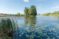 Small island with hut on lake and footbridge to him Royalty Free Stock Photo