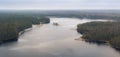 island in a lake among a large northern forest in deep autumn aerial photography