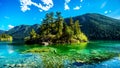 Small island in the middle of the crystal clear waters of Pavilion Lake in Marble Canyon Provincial Park, British Columbia Royalty Free Stock Photo