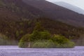An island in the middle of a large body of water, Loch an Eilein, Cairngorms National park, Scotland Royalty Free Stock Photo