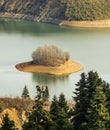 Small island in Plastiras lake at central Greece Royalty Free Stock Photo