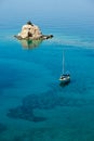 Small island solitary and sailing boat