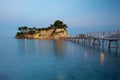 Small islet Agios Sostis connected with a bridge t Royalty Free Stock Photo