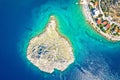 Small islet and Sveti Juraj turquoise beach under Velebit mountain aerial view Royalty Free Stock Photo