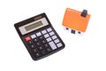 Small isolated calculator and toy house on white Royalty Free Stock Photo