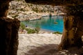 The small isolated gulf of Vathi, in Crete, with sandy beach and some lucky campers.