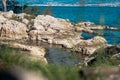 Small isolated pond hidden behind rocks