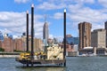A small jack-up platform barge in the east river near 20th St in Lower Manhattan