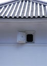 A small Japanese window details with blue tiled roof Royalty Free Stock Photo