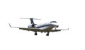 A small jet landing at an airport Royalty Free Stock Photo