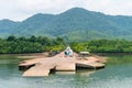 Small jetty for ferry on green tropical island