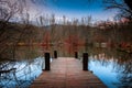 Small jetty on a small lake in autumn