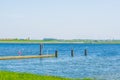 Small jetty in tholen city with boats sailing on the water, Scenery of the Oosterschelde, Bergse diepsluis, Zeeland, The