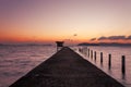 Small jetty in to the sea in Long exposure image of dramatic sunset or sunrise,sky and clouds over tropical sea scenery landscape Royalty Free Stock Photo
