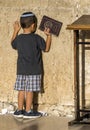 Small jewish boy praying at the Western Wall. Jerusalem, Israel