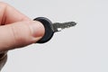Small key in hand finger Royalty Free Stock Photo