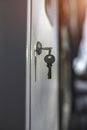 A small key stuck in the door lock Royalty Free Stock Photo