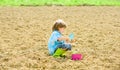 Small kid planting a flower. earth day. new life. summer farm. happy child gardener. botanic worker. Spring season Royalty Free Stock Photo