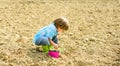Small kid planting a flower. earth day. new life. summer farm. happy child gardener. plant nursery. Spring. ecology life Royalty Free Stock Photo