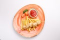 Small kid`s meal. A plate of chicken barbecue with french fries, cherry tomato, ketchup on a white background. Top view children Royalty Free Stock Photo