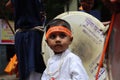 A small kid wearing traditional costume during a hindu festival. Child photography in india.