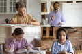 Small kids speak on video call with ethnic male teacher Royalty Free Stock Photo