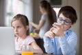 Small kids using gadgets playing games or watching video Royalty Free Stock Photo