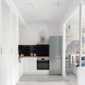 Small kitchen in bright white apartment Royalty Free Stock Photo