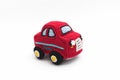Small knitted red baby machine on white background Royalty Free Stock Photo