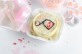 A small Korean bento cake for one or two person with romantic decor on light background