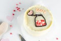 A small Korean bento cake for one or two person with romantic decor on light background