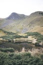 a small lake at the foot of the mountain. photo of the lake. calm water in the lake