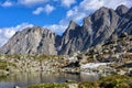 Small lake in hanging valley and mountain peaks