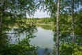 Small lake located in park in Siemianowice Slaskie, Silesia, Poland seen through the birch trees. Tranquil water surface with Royalty Free Stock Photo