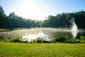 Small lake and morning fog Royalty Free Stock Photo