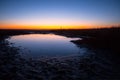 Small lake in a prairie at the twilight Royalty Free Stock Photo