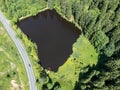 Small lake with road from above Royalty Free Stock Photo