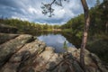 small lake among rocks and forest on a sunny autumn day. The famous Devil Lake in Karkaralinsk in Kazakhstan