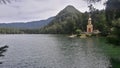 Small lake with chapel under a mountain Royalty Free Stock Photo