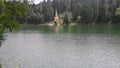 Small lake under a mountain, church in opposite side Royalty Free Stock Photo