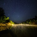 Small lake under stars at night with foggy vapour at summer Royalty Free Stock Photo