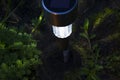 Small lantern at night in the summer garden. Royalty Free Stock Photo