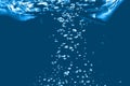 Small and large air bubbles in water on a blue background, the concept of natural water resources, ecology, save nature