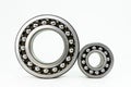 Small and large ball bearing close up, isolated on white background with clipping path. Royalty Free Stock Photo