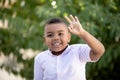 Small latin child counting with his fingers