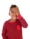 Small latin child covering his eye