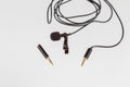 Small lavalier microphone or lapel mic with clip and adapter for computer Royalty Free Stock Photo