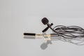 Small lavalier microphone or lapel mic with clip and adapter for computer Royalty Free Stock Photo