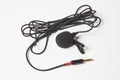Small lavalier microphone on white background