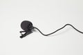 Small lavalier microphone on white background